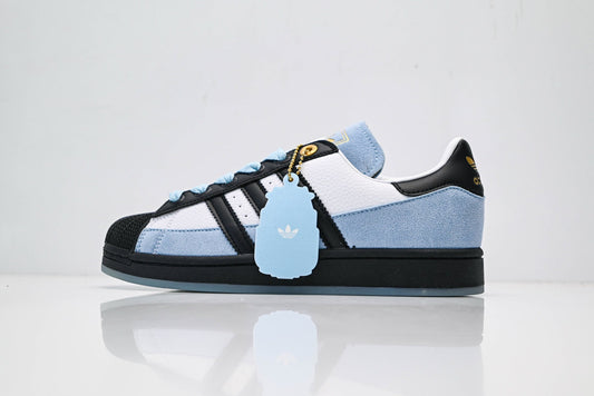 adidas Originals Superstar – Light Blue Upper with White 3-Stripes, Black Heel Tab & Gold Accents