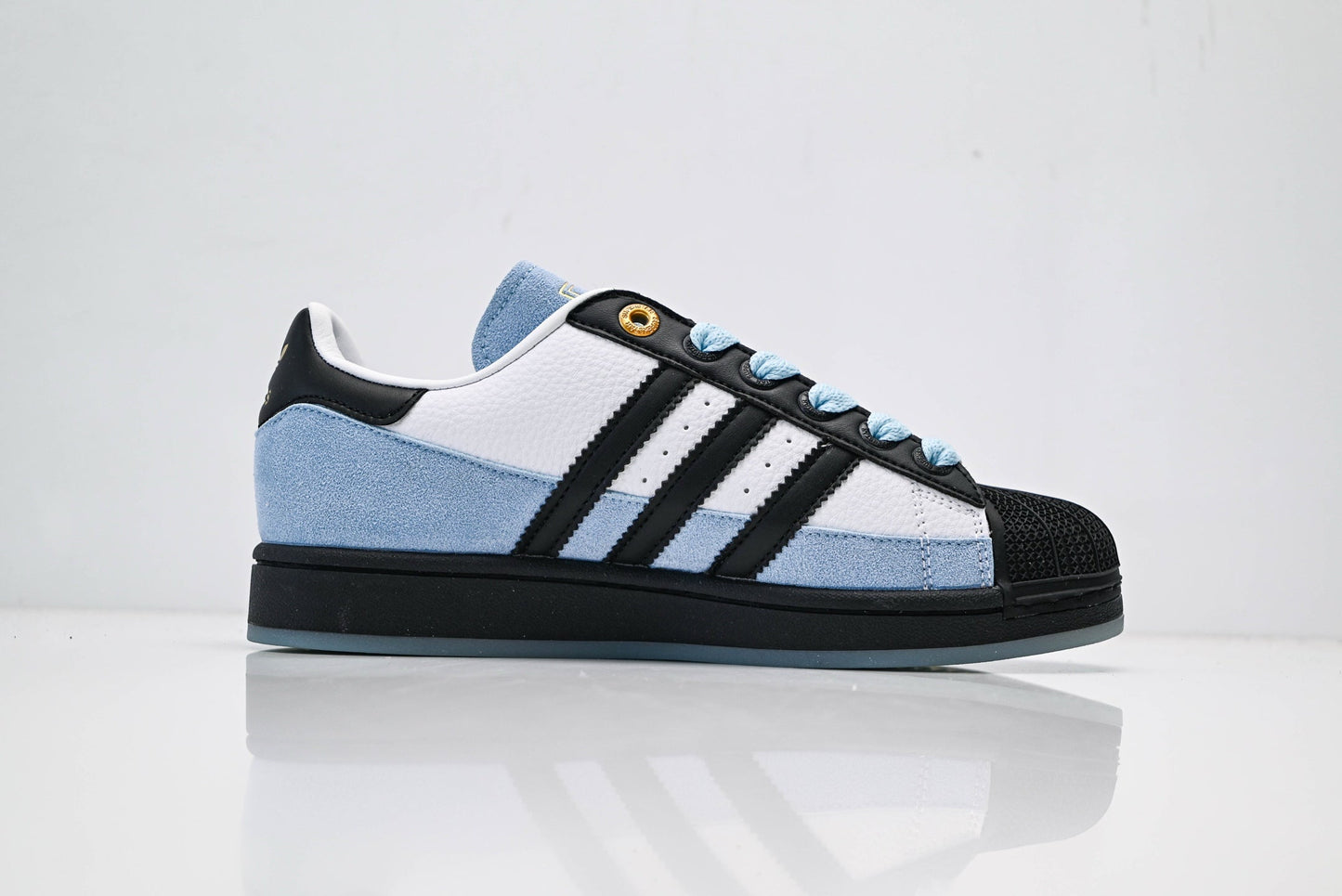adidas Originals Superstar – Light Blue Upper with White 3-Stripes, Black Heel Tab & Gold Accents