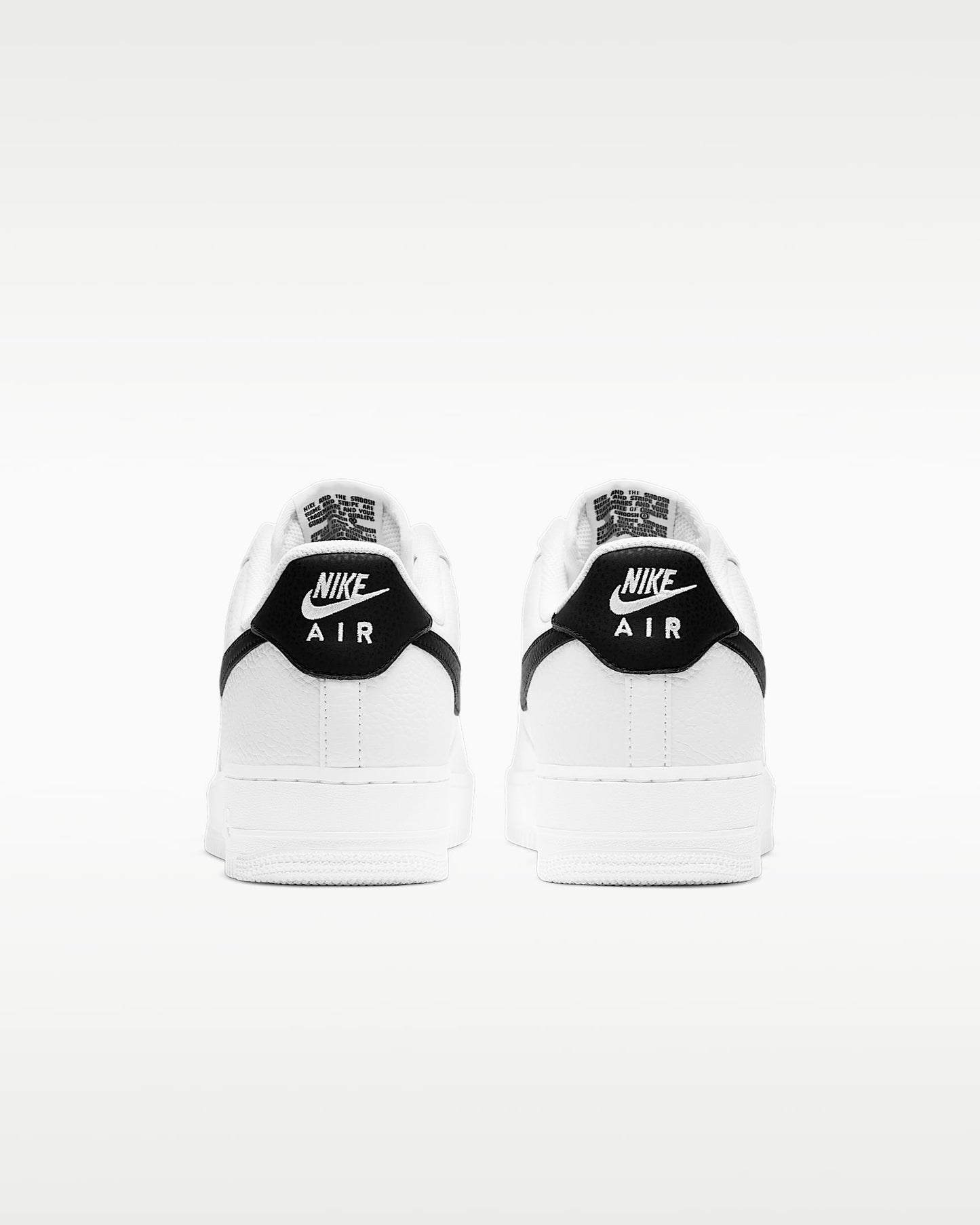 Nike Air Force 1 '07 White Pebbled Leather Black Swoosh Sneakers