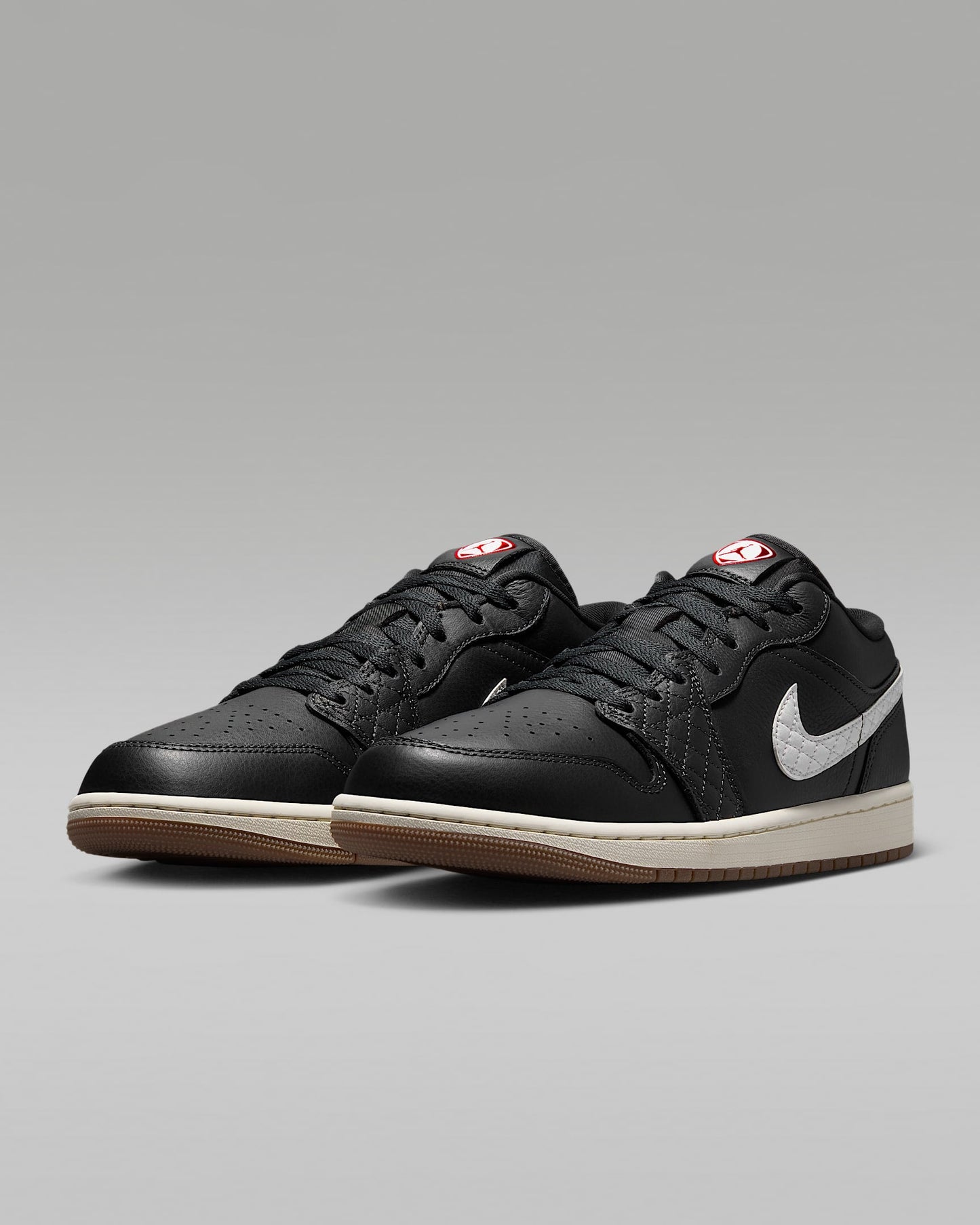 Air Jordan 1 Low Black White Quilted Swoosh Gum Outsole Leather Sneakers