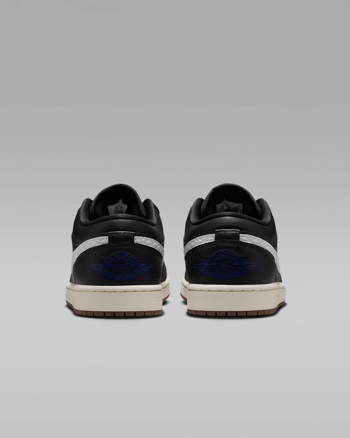 Air Jordan 1 Low Black White Quilted Swoosh Gum Outsole Leather Sneakers