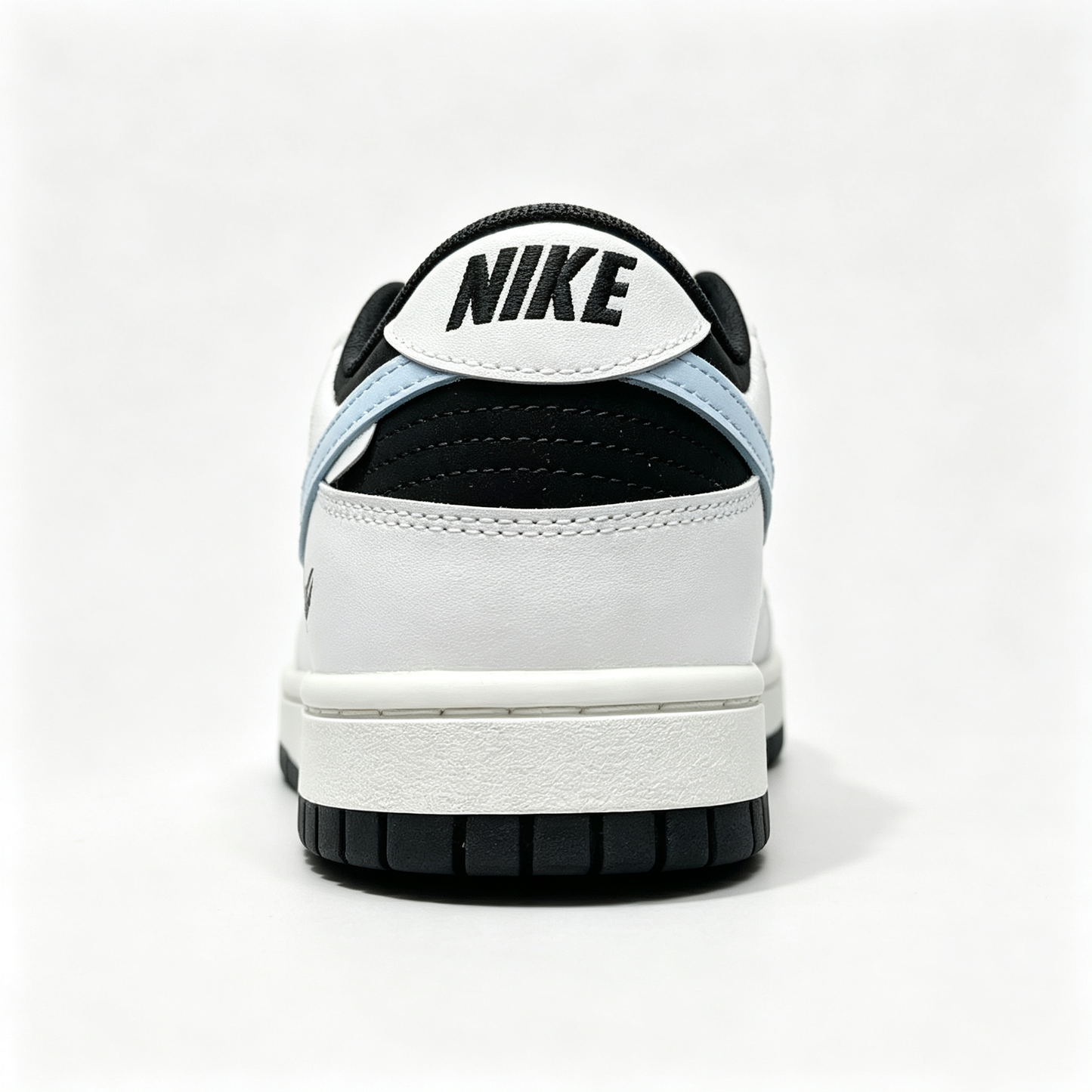 Nike Dunk Low 'Miracle' — Black & White with Light Blue Swoosh & Heel Print